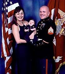 Family man: Sgt. Travis Twiggs with his wife, Kellee, and daughter.